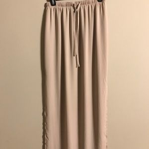 Sheer nude floor length skirt.